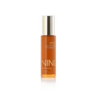 NINI Organics Juicy Multi-C Bio Brightening Serum, 50ml bottle with gold cap.