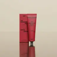 Red tube and box of AKT Santal Nomad deodorant balm, 50ml, with saffron, sandalwood, leather.
