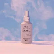 Body mist bottle labelled "The Haze" with cedar, eucalyptus, and bitter orange.