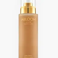 Abloom Slow Skincare Organic Soothing Lotion in a gold-capped bottle.