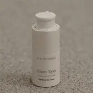 Eco by Sonya Glory Eyes Brightening Eye Cream on speckled surface.