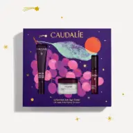 Caudalie skincare gift set with eye cream, serum, and cream on purple grape-themed box.