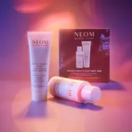 NEOM Perfect Night's Sleep Body Duo with body butter and oil against a purple background.