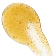 Golden gel with bubbles on a white background.