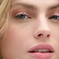 Close-up of a woman's face with pink eyeshadow and lipstick. Text: "Desert Rose".