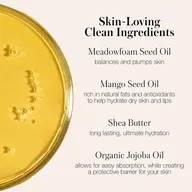 Yellow liquid with text: Skin-Loving Clean Ingredients, Meadowfoam Seed Oil, Mango Seed Oil, Shea Butter, Organic Jojoba Oil.