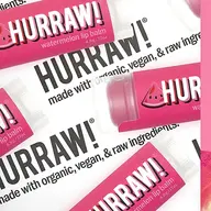 Pink Hurraw! watermelon lip balm tubes with text on organic, vegan ingredients.