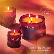 Purple NEOM candles with flames, text: "Limited Edition, Scent to Help De-Stress".