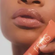 Close-up of glossy lips with RMS lip gloss tube. Text: "Liplights" and "BISOU".