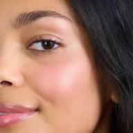 Close-up of a woman's face with smooth skin and text "BOHEMIAN GIRL" in the corner.