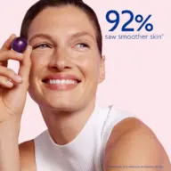 Woman holding a purple sphere, text reads "92% saw smoother skin".