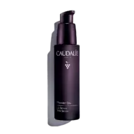 Dark purple bottle of Caudalie Premier Cru Le Sérum with pump dispenser.
