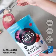 Planet Paleo Beauty Collagen powder being added to a pink drink.
