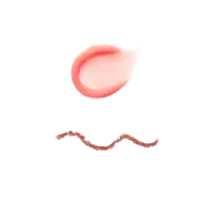 Pink cream smear above a wavy line of brown scrub on a black background.