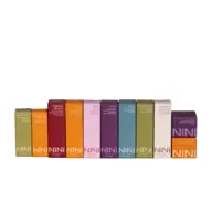 Colourful NINI Organics skincare boxes in a row, each with different product names.