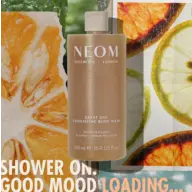 NEOM Great Day Exfoliating Body Wash with citrus slices and text: "Shower on. Good mood loading...