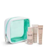 Clear toiletry bag with Neom body cleanser, body butter, and calming pen.