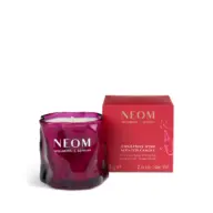 Purple NEOM candle with red box, labelled "Christmas Wish Scented Candle".