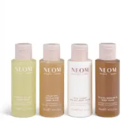 Four NEOM body wash bottles, each 50ml, with different labels and colours.