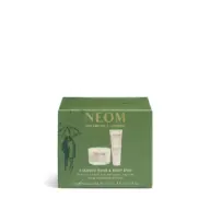Green box with NEOM Wellbeing London logo, containing a candle and body butter duo.