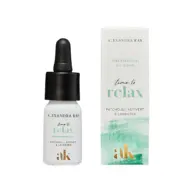 Essential oil bottle and box, labelled "time to relax" with patchouli, vetivert, and lavender.