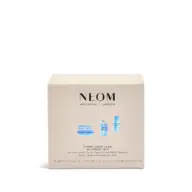 NEOM Wellbeing De-Stress Trio box with candle, bath milk, and calming pen.