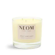 NEOM candle with lavender, chamomile, and patchouli scent in a glass jar.