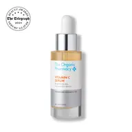 The Organic Pharmacy Vitamin C Serum bottle with dropper and award badge.