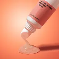 Tube dispensing gel with botanical lipids, beeswax, honey. Label: All skin types. Orange background.