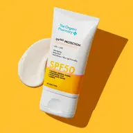 The Organic Pharmacy SPF 50 sunscreen tube on yellow background.