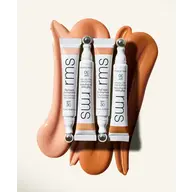 Four RMS ReFresh Eye Brightener tubes on swirled beige and brown cream background.