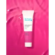 Tube of Ultra Calming Eye Cream on a pink background.