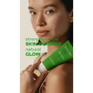 Woman holding Weleda Skin Food tube, text: "strengthens the skin barrier, natural glow".
