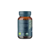 Brown bottle with blue label, organic certification logos, and contact details for Ayurvedic company.