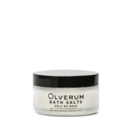 Olverum Bath Salts jar with black lid, labelled with essential oils.