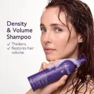 Woman holding Caudalie Density & Volume Shampoo bottle with wet hair. Text: Thickens, Restores hair volume.