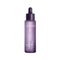 Purple bottle of Caudalie Anti-Hair Loss Serum with dropper lid.