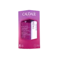 Caudalie gift set with hand cream and lip balm in purple packaging.