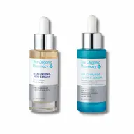 Two bottles of The Organic Pharmacy serums: Hyaluronic Acid and Niacinamide Ultra 5.