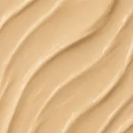 Smooth beige cream texture with wavy lines.