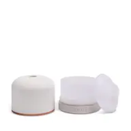 White essential oil diffuser with removable lid and control buttons.