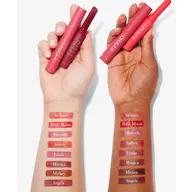 Two hands holding rms lipsticks with swatches on forearms, shades labelled Melanie to Angela.