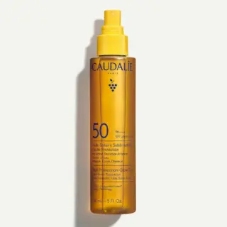 Caudalie SPF 50 High Protection Glow Oil, 150ml bottle, yellow spray cap.