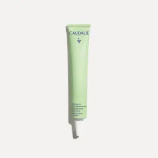 Green tube of Caudalie Vinopure Salicylic Spot Solution on white background.