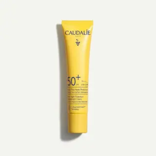 Yellow tube of Caudalie SPF 50+ sunscreen with UVA/UVB protection.