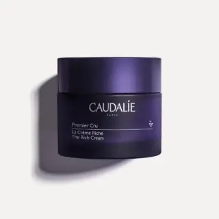 Dark purple jar labelled "Caudalie Premier Cru La Crème Riche The Rich Cream".