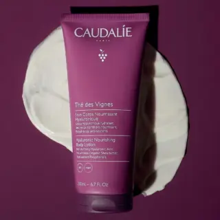 Caudalie Thé des Vignes Hyaluronic Nourishing Body Lotion, 200ml, on purple background.