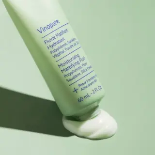 Vinopure Moisturising Mattifying Fluid, 60 mL, green tube on green background, cream oozing out.