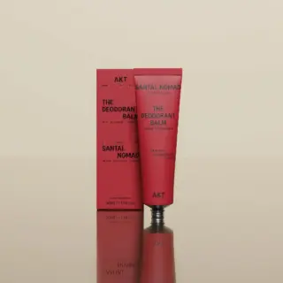 Red tube and box of AKT Santal Nomad deodorant balm, 50ml, with saffron, sandalwood, leather.