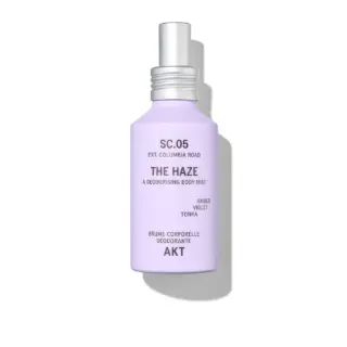 Lavender bottle of AKT The Haze deodorising body mist with silver cap.